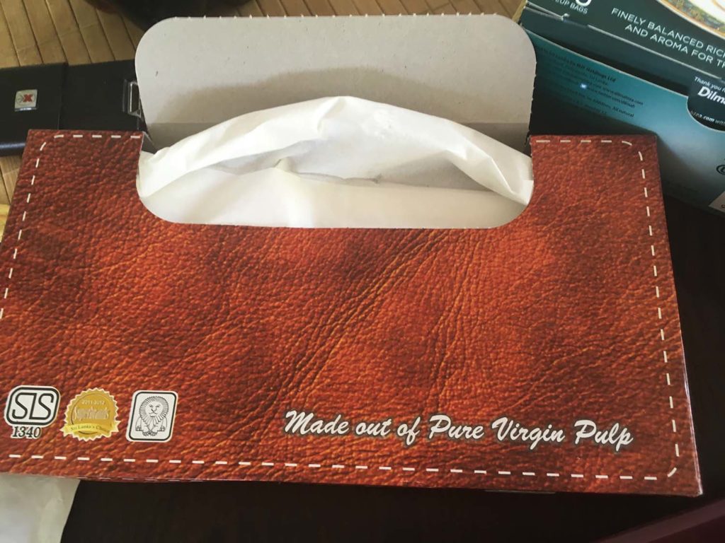 A box of tissues that state 'made out of Pure Virgin Pulp. 